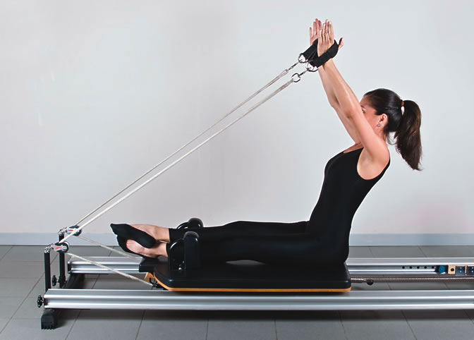 Woman on Pilates machine